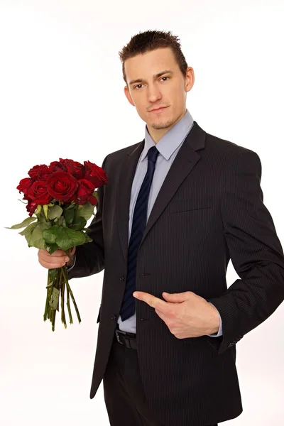 Man holds bouquet of red roses — Stock Photo, Image