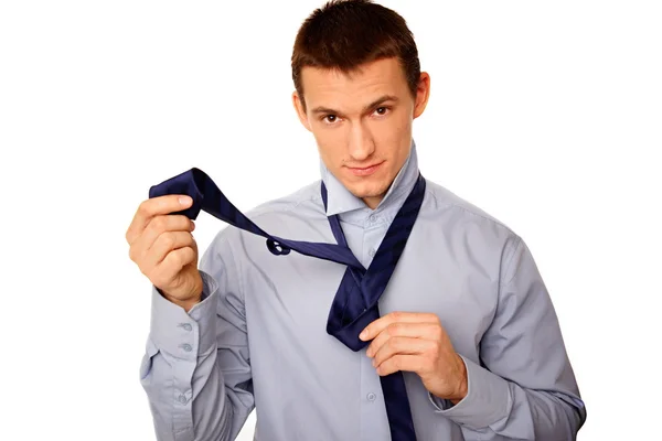 Businessman adjusts a tie — Stock Photo, Image