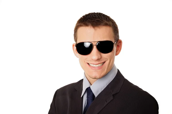 Smiling businessman in sunglasses. — Stock Photo, Image