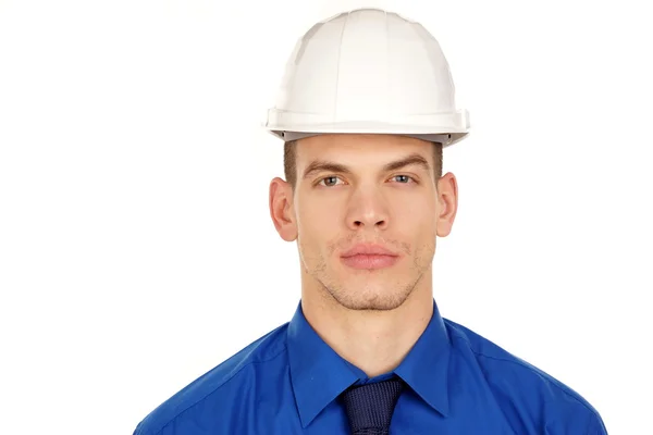 Empresário em camisa azul em um capacete . — Fotografia de Stock