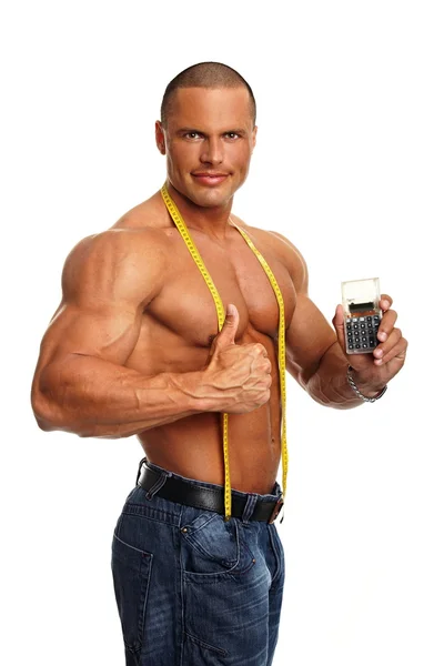 Muscular man with meter and calculator — Stock Photo, Image