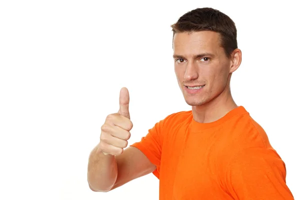 Man in orange shirt shows you finger up — Stock Photo, Image