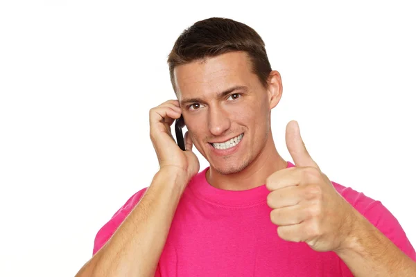 Man with phone and shows you finger up — Stock Photo, Image