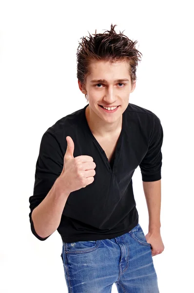 Young man gesturing thumb up sign — Stock Photo, Image