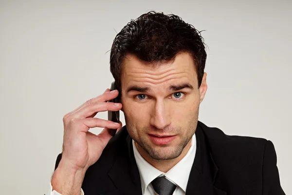 Handsome man talks at mobile phone. — Stock Photo, Image