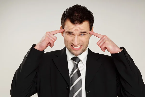 Handsome man has a headache — Stock Photo, Image