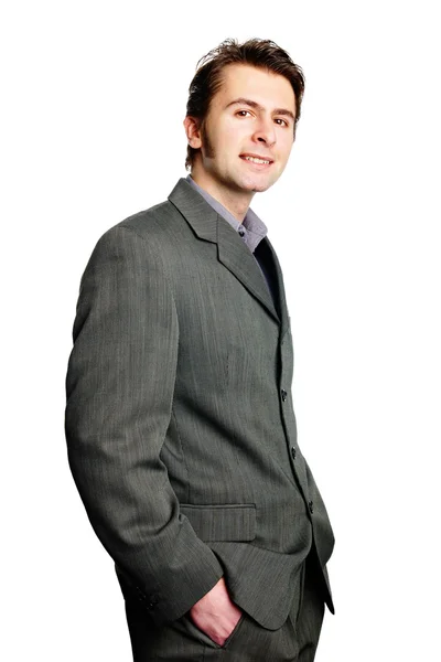 Handsome businessman with hands in pockets — Stock Photo, Image
