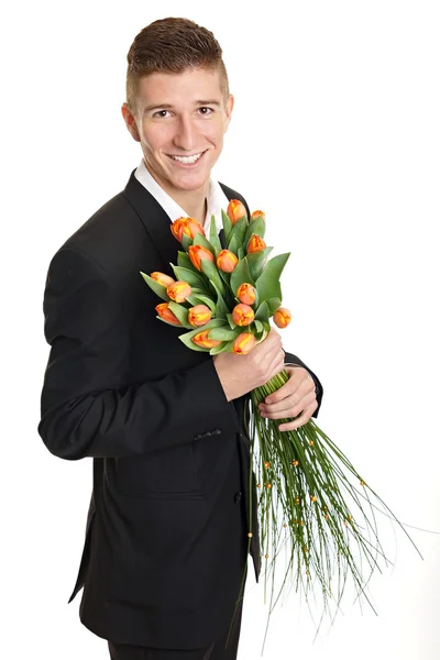 Man holds bouquet of tulips — Stock Photo, Image