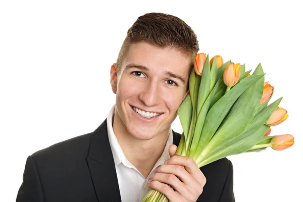 Homem detém buquê de tulipas — Fotografia de Stock