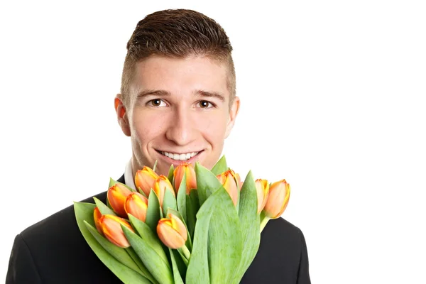 Homme tient bouquet de tulipes — Photo