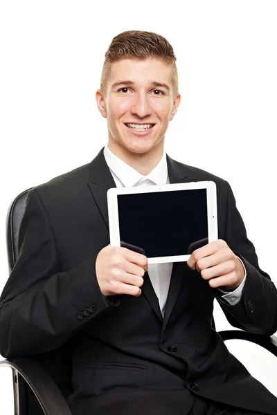 Businessman shows tablet pc — Stock Photo, Image