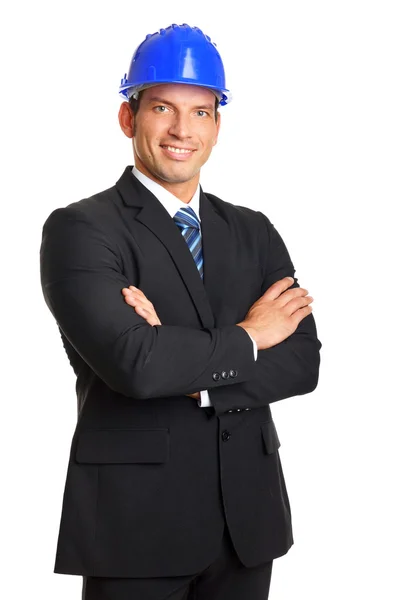 Businessman standing in protective helmet — Stock Photo, Image