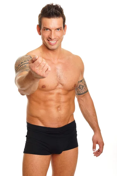 Muscular man shows his arm — Stock Photo, Image