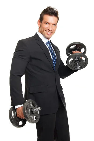 Podnikatel v obleku drží činky — Stock fotografie