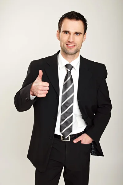 Businessman gesturing thumb up — Stock Photo, Image