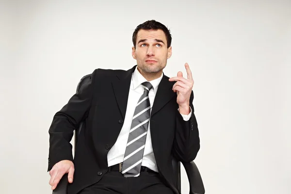 Businessman sitting on chair — Stock Photo, Image