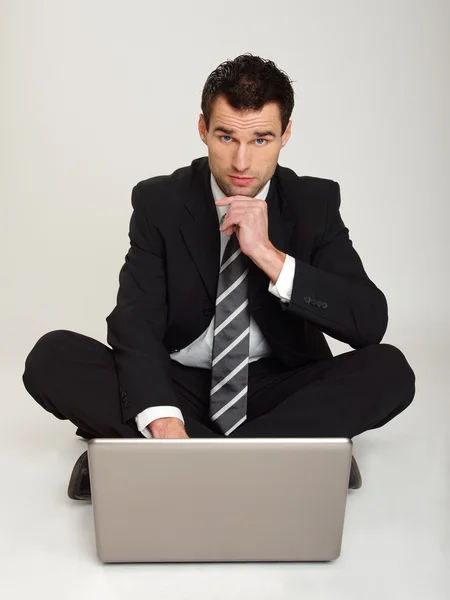 Businessman thinking at the computer — Stock Photo, Image