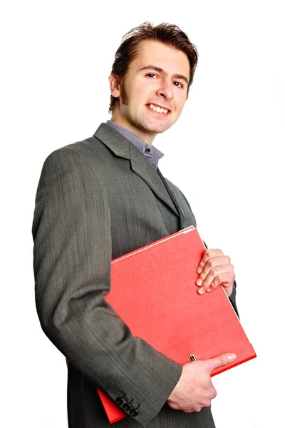 Man in suit holds red worktops — Stock Photo, Image