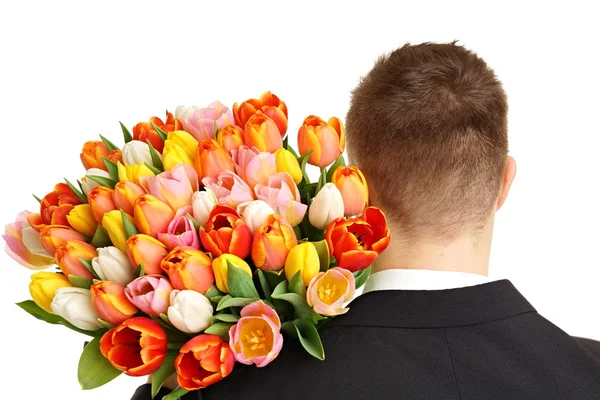 Ramo de tulipanes en el hombro del hombre — Foto de Stock