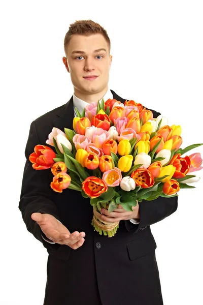 Hombre con gran ramo de tulipanes — Foto de Stock
