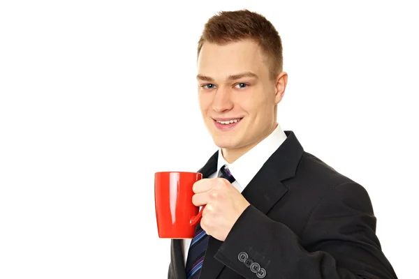 Fekete öltöny ember iszik kávét — Stock Fotó