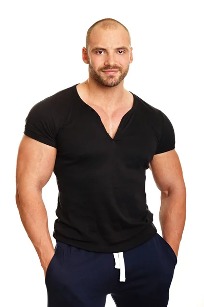 Muscular man in black shirt — Stock Photo, Image