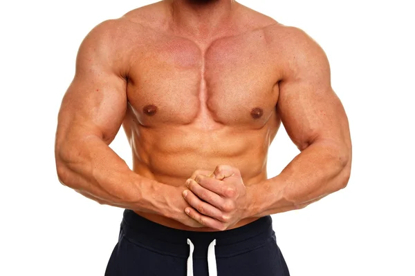 Muscular man shows his muscles — Stock Photo, Image