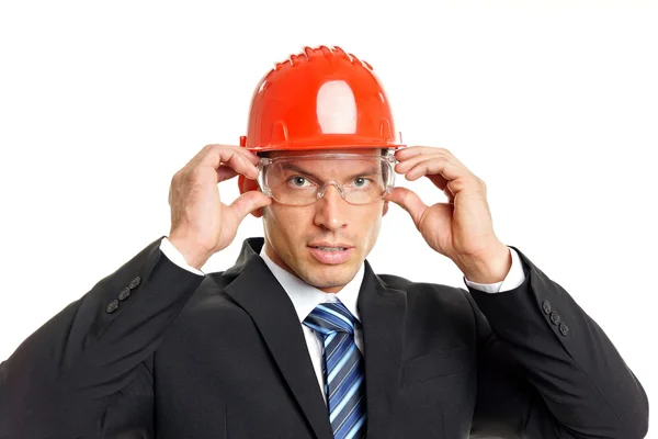 Businessman in a helmet and goggles — Stock Photo, Image