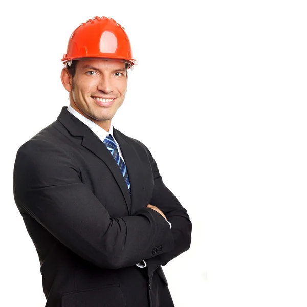 Businessman standing in protective helmet — Stock Photo, Image