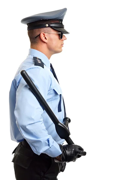 Улыбающийся полицейский с дубинкой — стоковое фото