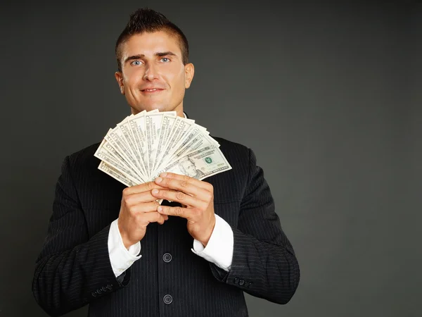 Biznesmen pokazuje Ci pieniądze — Zdjęcie stockowe