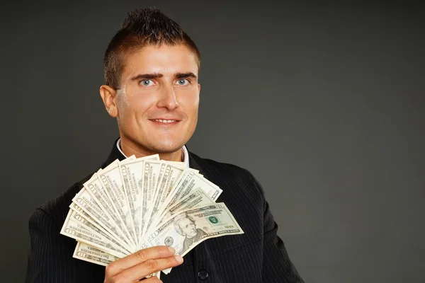Geschäftsmann zeigt Ihnen Geld — Stockfoto
