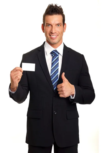 Handsome businessman shows business card — Stock Photo, Image