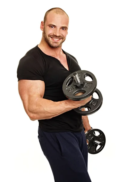 Muscular Man exercises with dumbbells — Stock Photo, Image