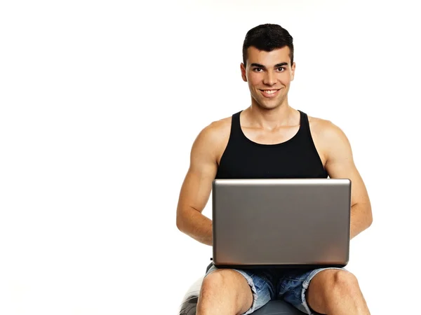 Young man sitting with computer — Stock Photo, Image