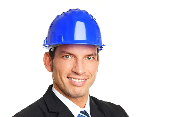 Businessman standing in protective helmet — Stock Photo, Image