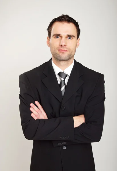 Handsome businessman with folded hands. — Stock Photo, Image