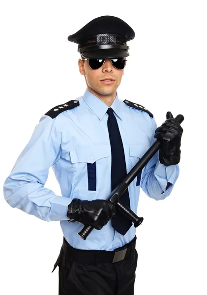 Policeman holds nightstick in hands — Stock Photo, Image