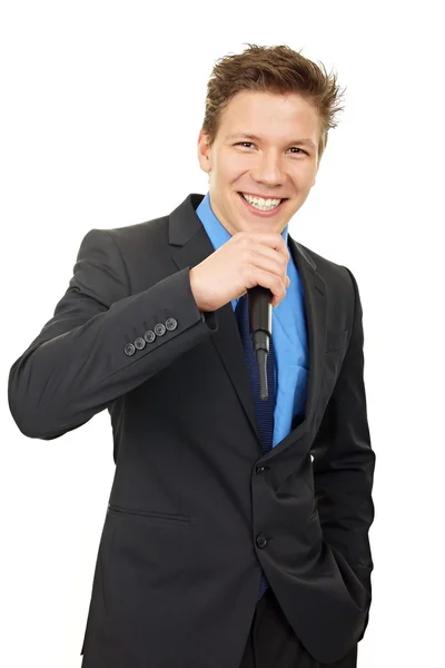 Businessman singing in microphone — Stock Photo, Image