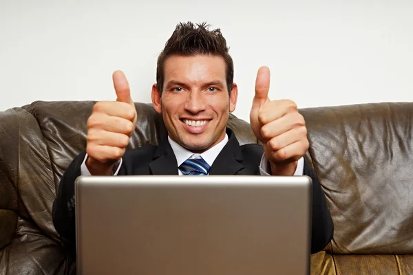 Businessman gesturing thumbs up sign — Stock Photo, Image