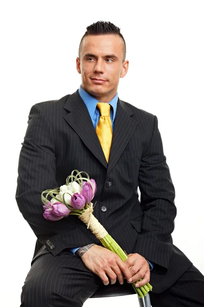 Man holds bouquet of flowers tulips — Stock Photo, Image