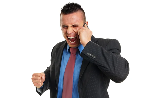 Angry man talks into mobile phone — Stock Photo, Image