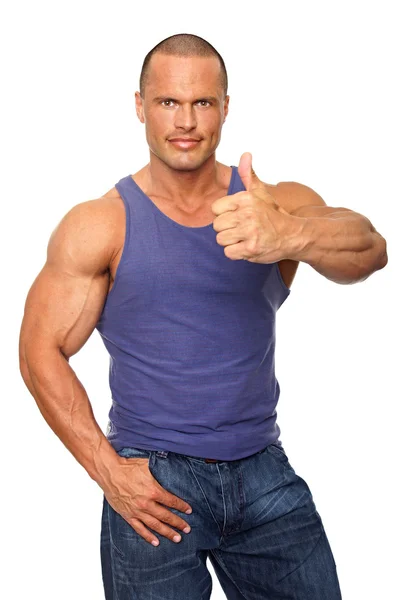 Homem muscular gesto sinal polegar para cima — Fotografia de Stock