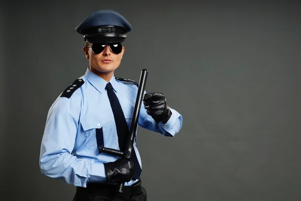 Young policeman in leather gloves Royalty Free Stock Photos