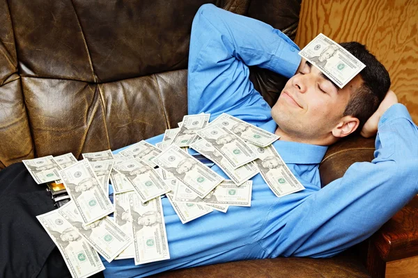 Businessman lying on the couch