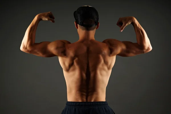 Big man shows his muscular back — Stock Photo, Image