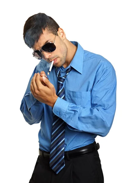 Businessman smokes a cigarette — Stock Photo, Image