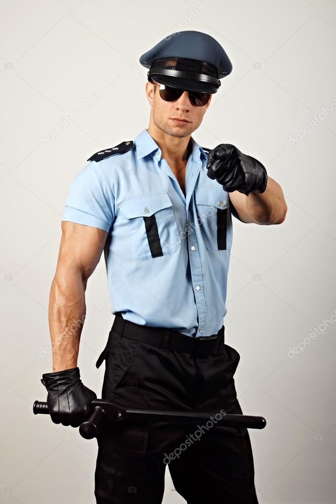 Policeman pointing towards camera