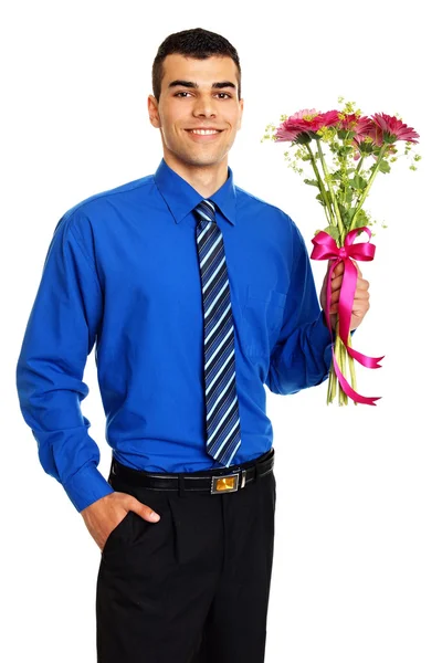 Man holds pink Gerbera flowers — Stock Photo, Image