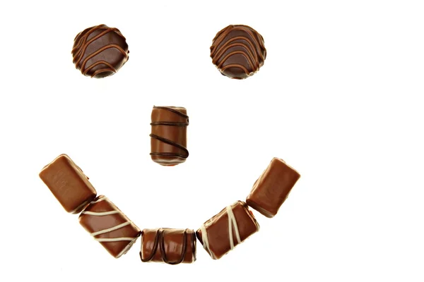 Smile from tasty chocolates candies — Stock Photo, Image